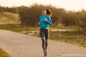 young happy sportswoman running road morning copy space 637285 3758.jpg