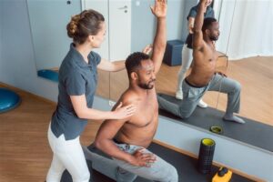 Physical Therapist Helping Patient Shoulder